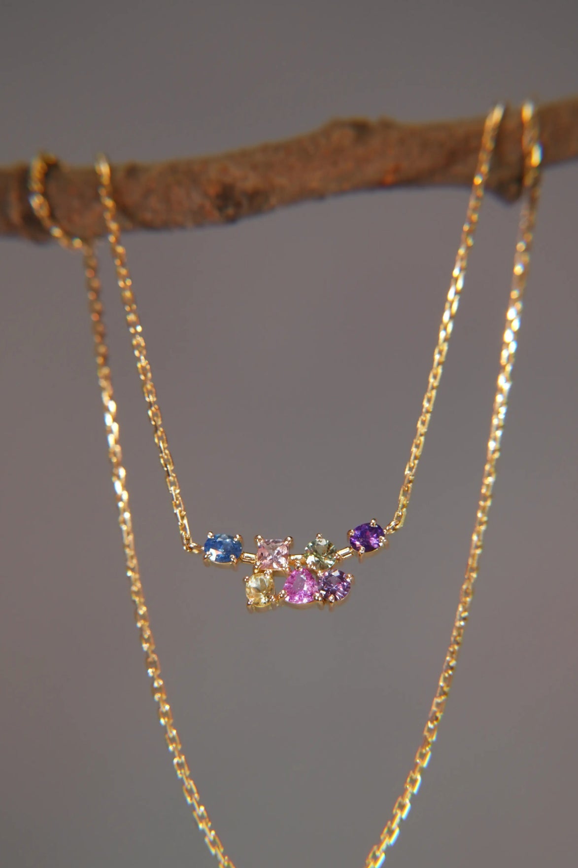 Gold necklace with multicolored sapphires on delicate chain, luxury jewelry by Eclat d'or