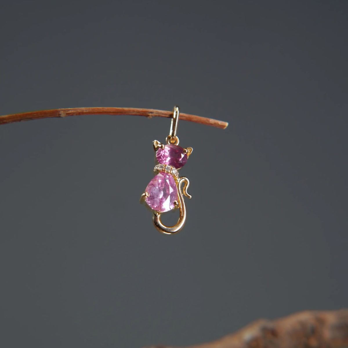 Gold cat pendant with pink gemstones and diamonds on a branch, Eclat d'or fine jewelry