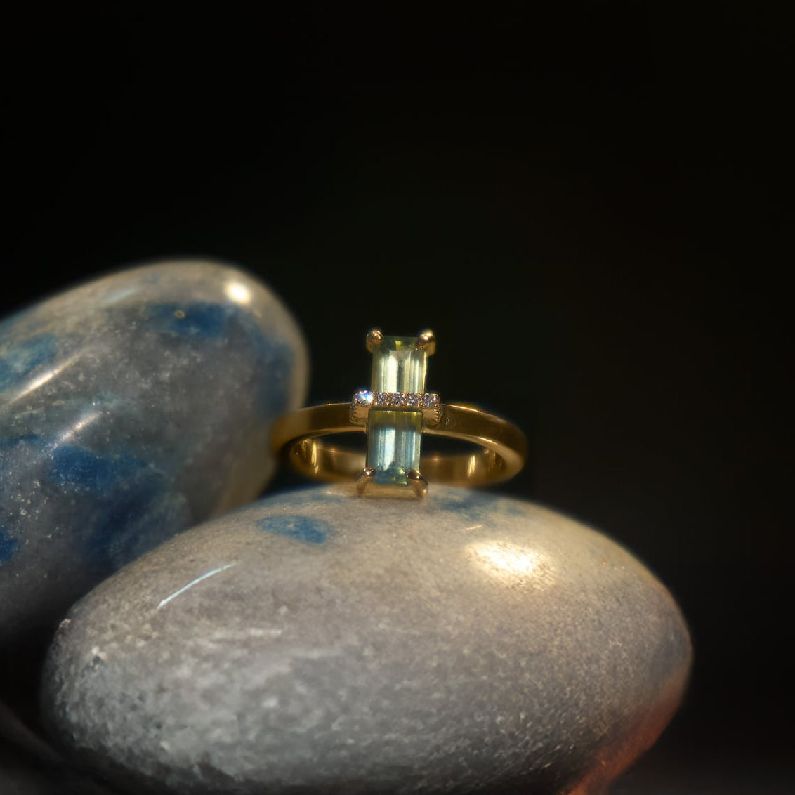 Gold ring with rectangular sapphire and diamond accents from Eclat d'or on smooth stones