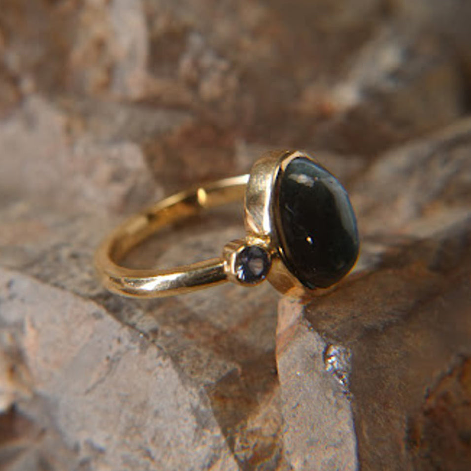 Gold ring with oval alexandrite stone and small round sapphire on textured stone, Eclat d'or jewelry